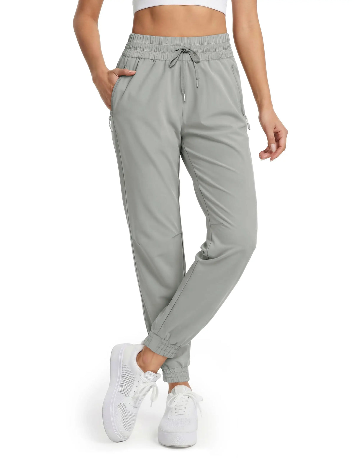 Magcomsen waterproof hiking pants for women in vibrant tomato red, designed for outdoor adventures and durable performance.