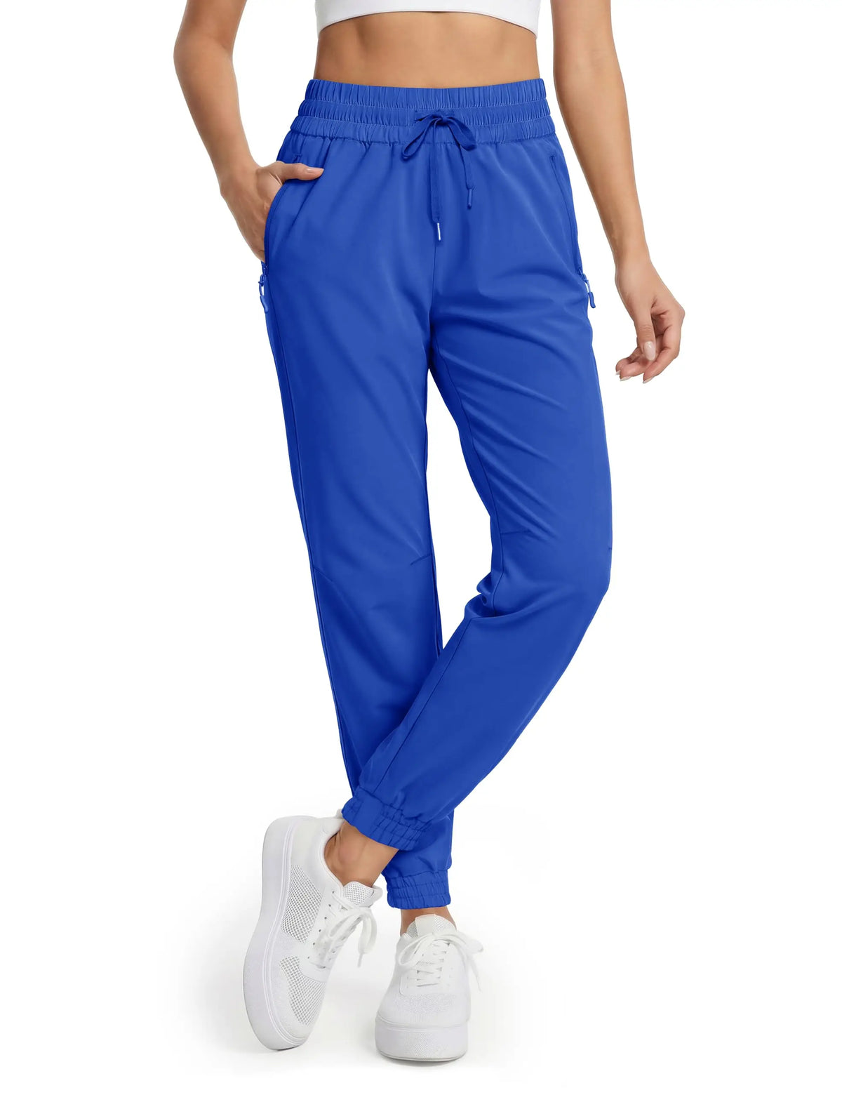 Magcomsen waterproof hiking pants for women in vibrant red, designed for outdoor activities and hiking adventures.