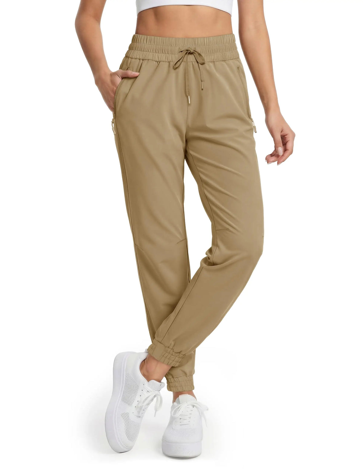 Magcomsen waterproof hiking pants for women in vibrant tomato red, featuring durable fabric and adjustable waist for outdoor adventures.