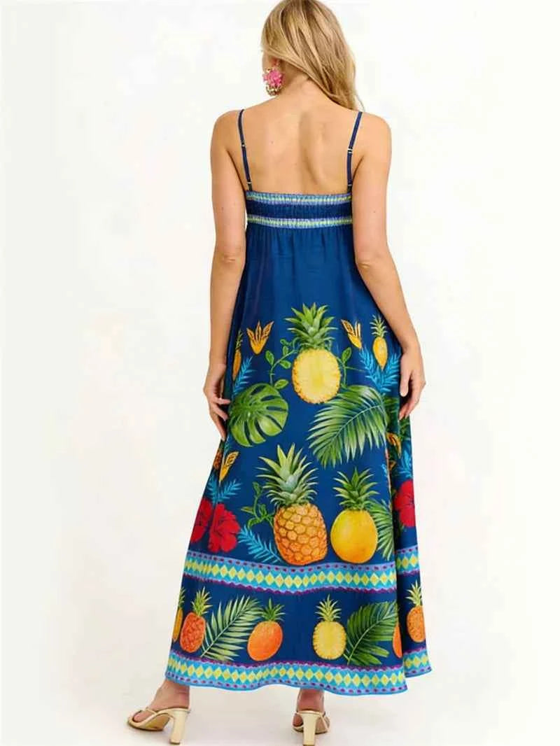 Elegant long floral dress for women by Corporación Turística, featuring a vibrant turquoise print and flowy fabric.