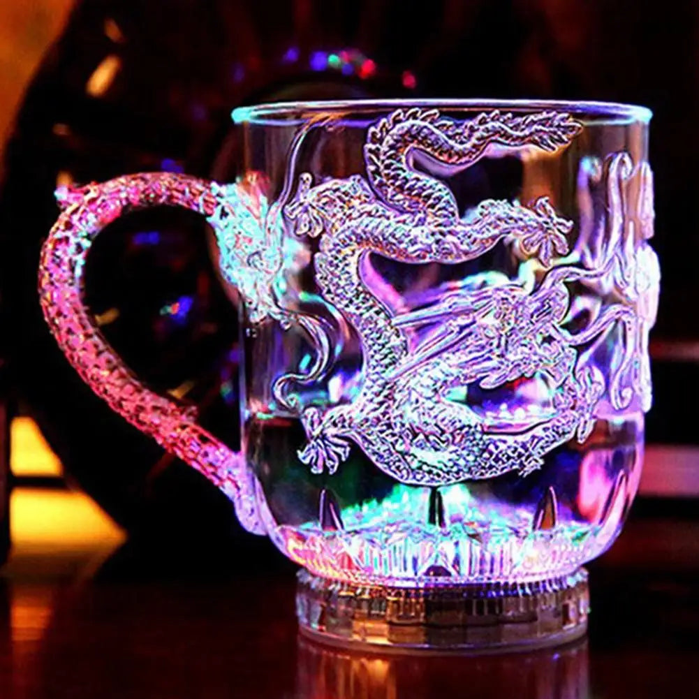 Transparent LED dragon mug by Corporación Turística with color-changing light activated by water, ideal for parties and celebrations.
