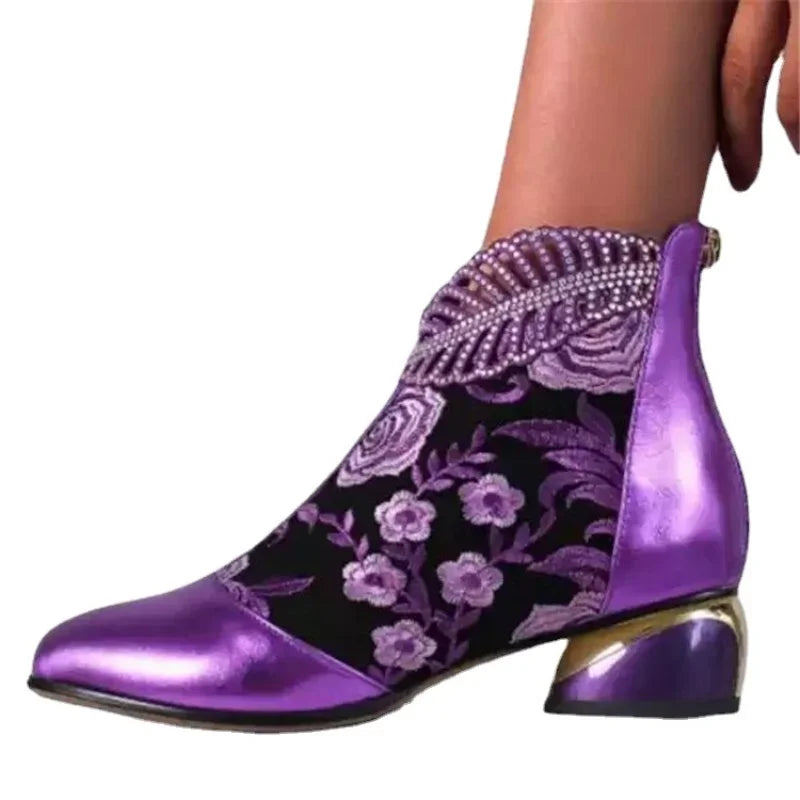 Green leather embroidered women's ankle boots by Corporación Turística, featuring stylish design and decorative stitching.