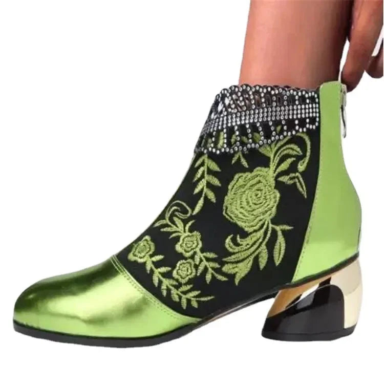 Green leather embroidered women's ankle boots by Corporación Turística, showcasing detailed stitching and stylish design.