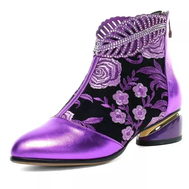 Green women's leather ankle boots with floral embroidery, stylish and comfortable for casual or dressy occasions.