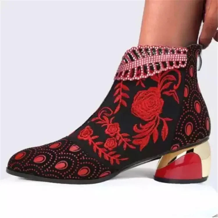 Green women's leather ankle boots with intricate embroidery, stylish and comfortable footwear by Corporación Turística.
