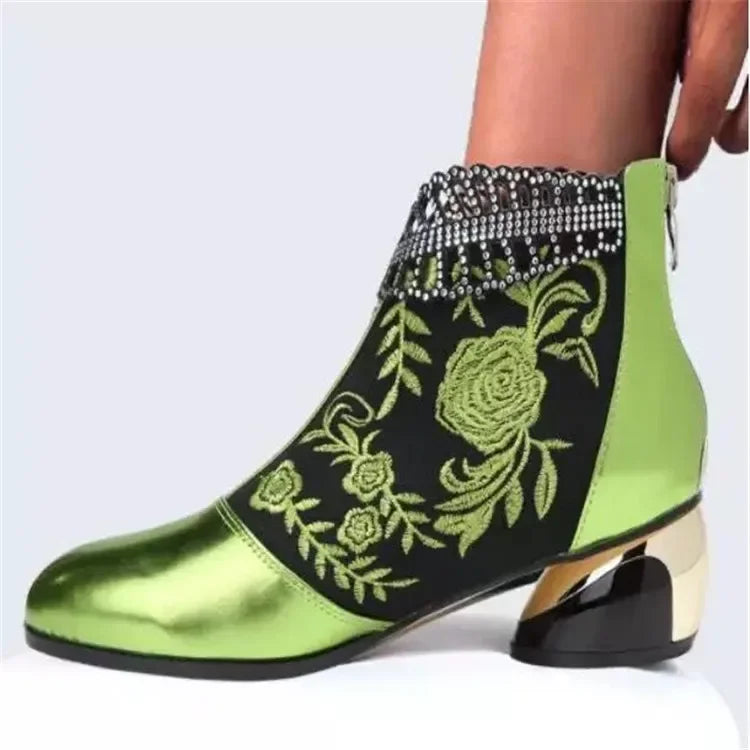 Green leather embroidered women's ankle boots by Corporación Turística, stylish and comfortable footwear with detailed stitching.