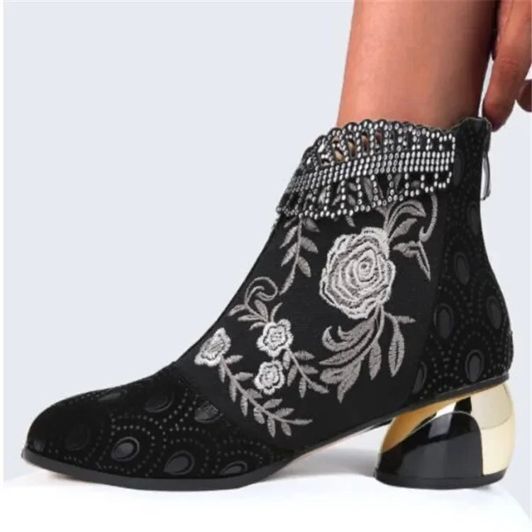 Green leather embroidered women's ankle boots from Corporación Turística, featuring a stylish and comfortable design.