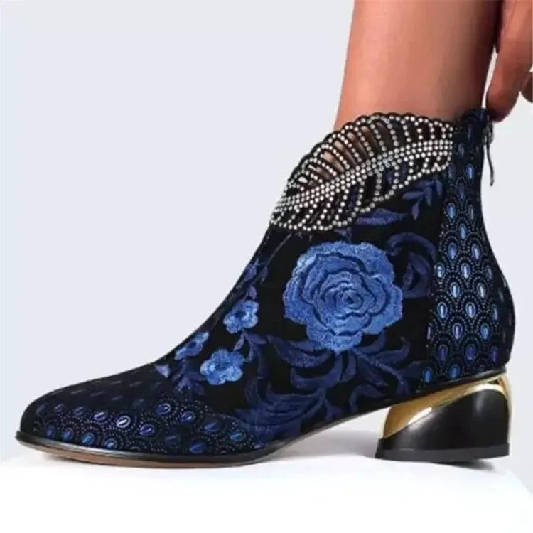 Green leather embroidered women's ankle boots by Corporación Turística with stylish stitching and a sleek design.