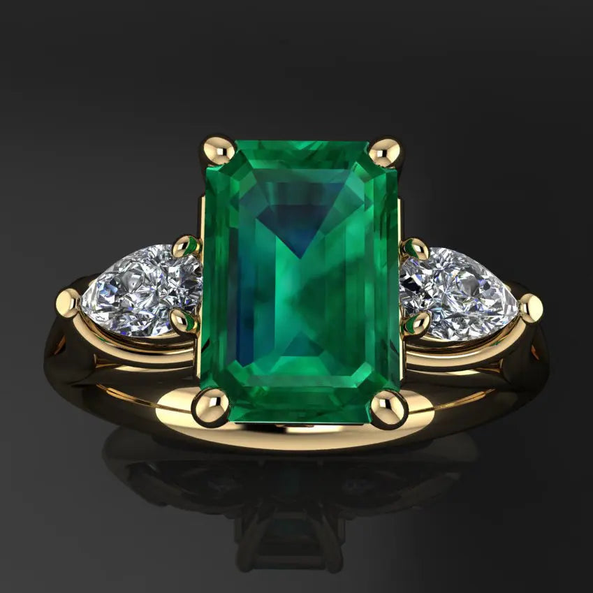 14k gold jewelry emerald ring for women with a vibrant green emerald gemstone, showcasing elegant design.