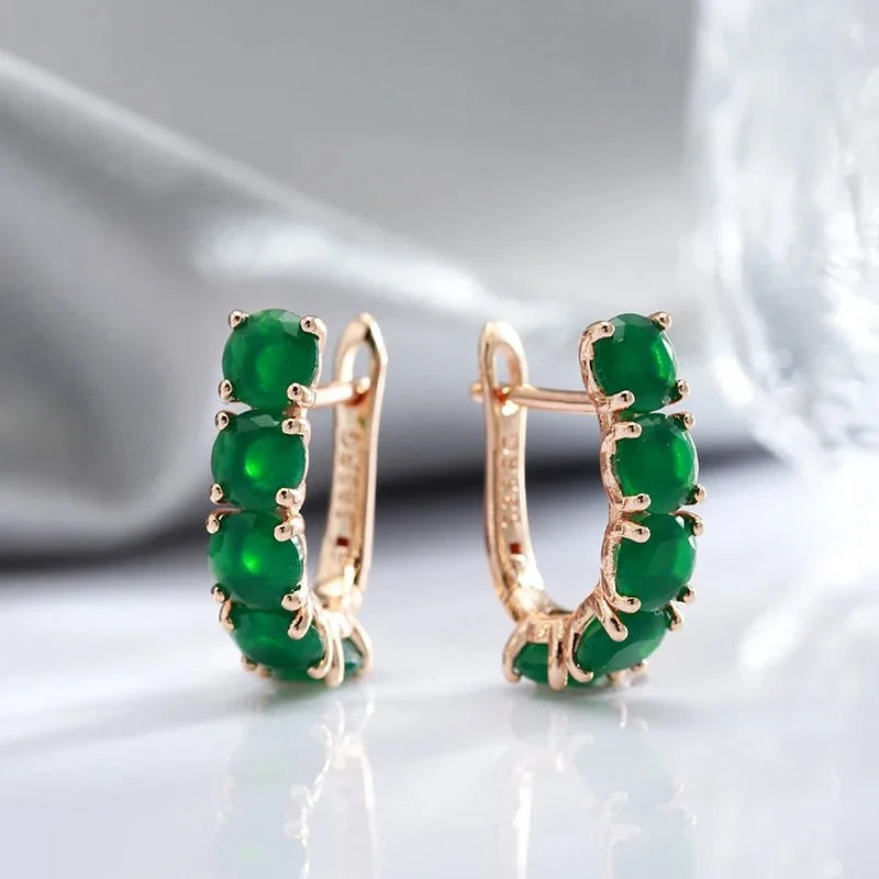 Multiple 14K gold ring for women with natural emeralds, featuring a stylish design and vibrant green gemstones.