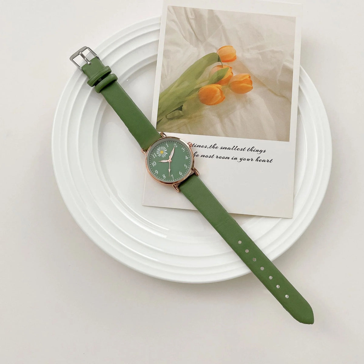 Electronics bracelet featuring a round pointer and quartz watch from Corporación Turística, shown in green.