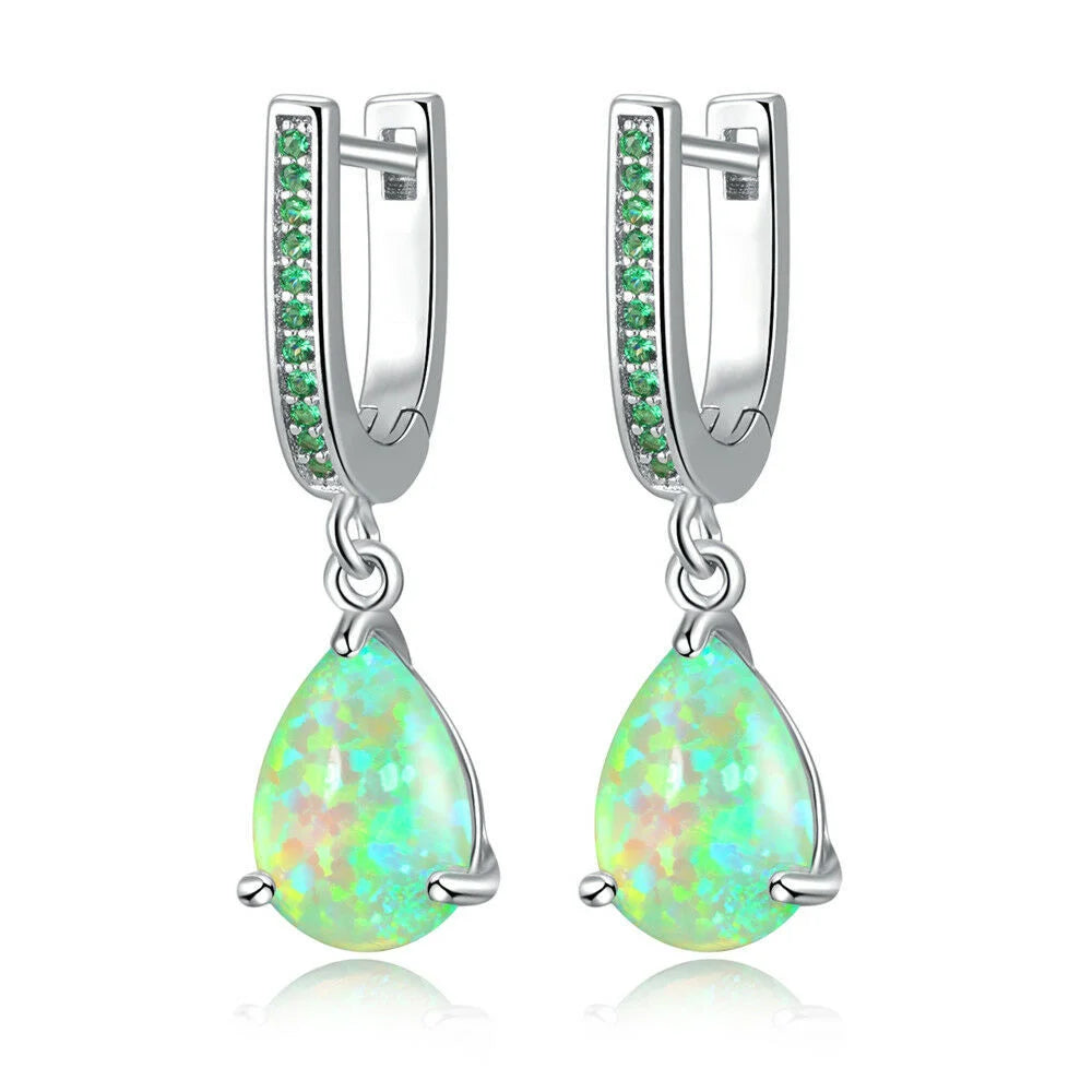 Green fire opal dangle earrings for women, featuring vibrant gemstone pendants with silver hooks.