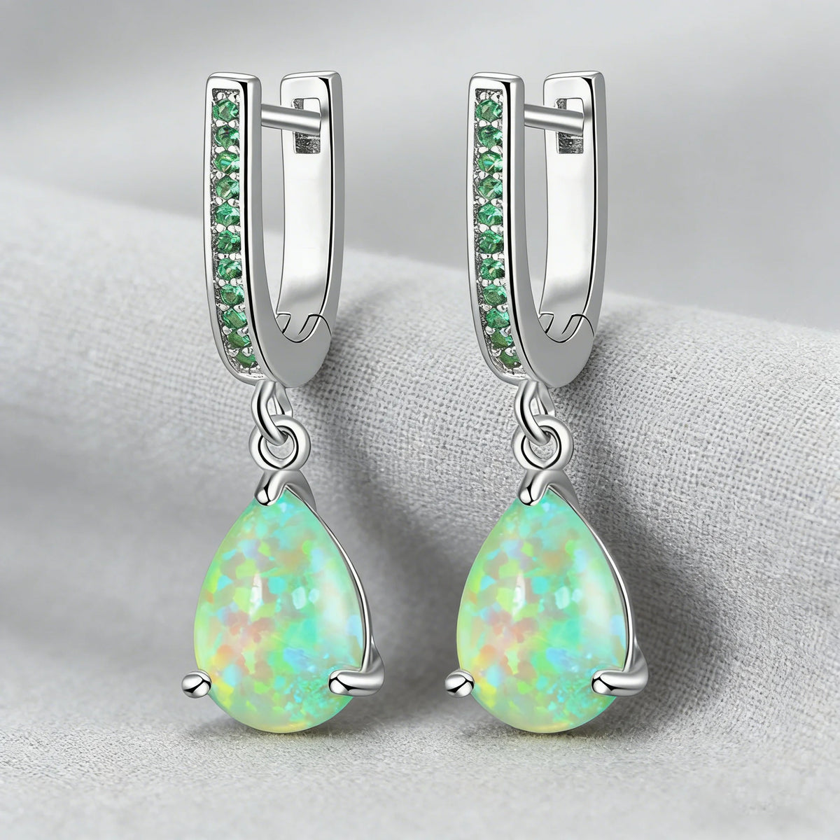 Green fire opal dangling earrings for women, featuring vibrant, iridescent gemstone and elegant silver hooks.