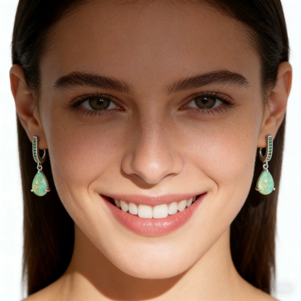Green fire opal pendant earrings for women, featuring teardrop-shaped pendants with silver hooks, stylish and elegant jewelry.