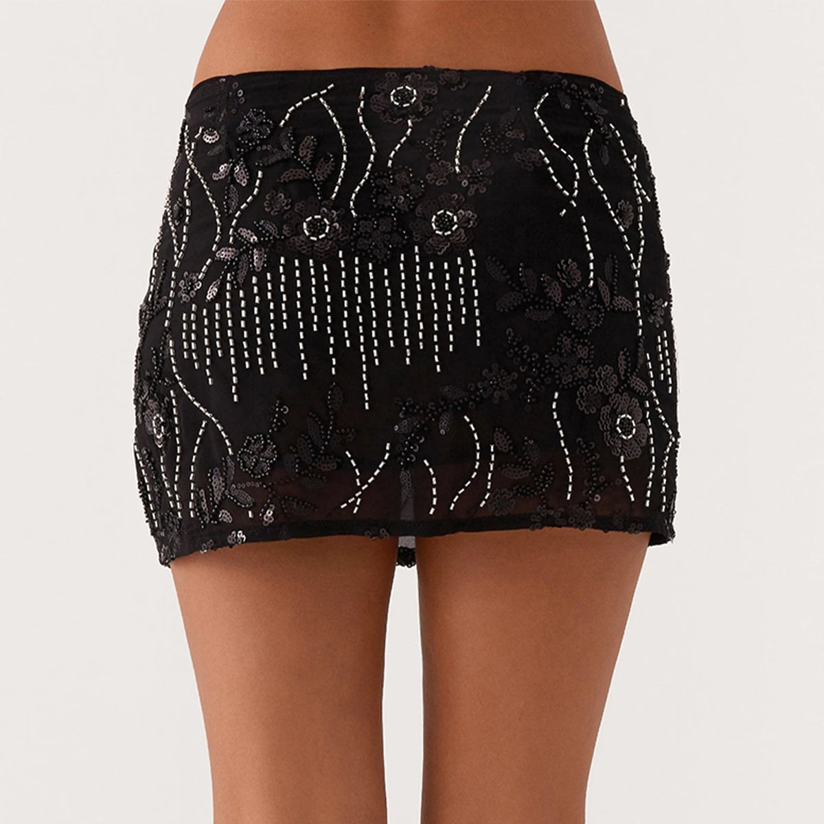 Green sequin miniskirt for women by Corporación Turística, featuring a flared design and stylish details perfect for fashionable outings.