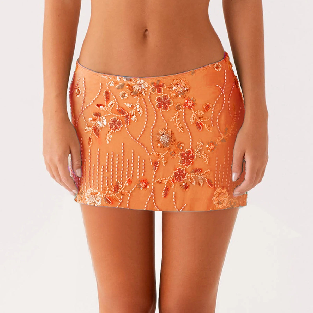 Green women's sequin mini skirt with a flared design, featuring a stylish and eye-catching look for fashionable outfits.