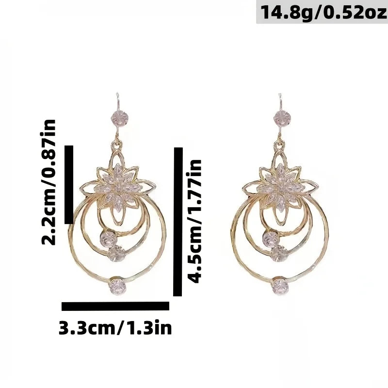 Exquisite floral and circle design earrings by Corporación Turística, stylish jewelry with intricate metalwork.