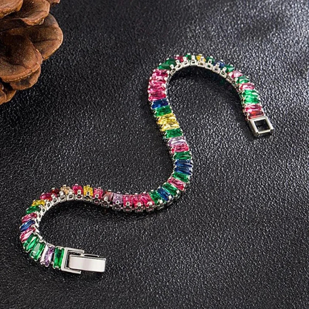 Exquisite sterling silver bracelet with sparkling crystals from Corporación Turística, showcasing intricate design and polished finish.