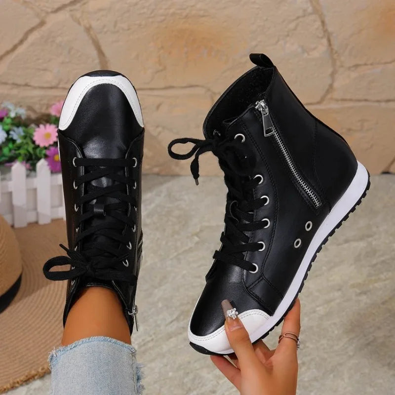 White women's spring and fall ankle boots from Corporación Turística, featuring a sleek design and comfortable fit.
