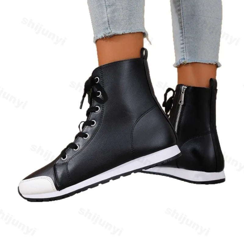 White women's spring and fall ankle boots from Corporación Turística, featuring a stylish short boot design.