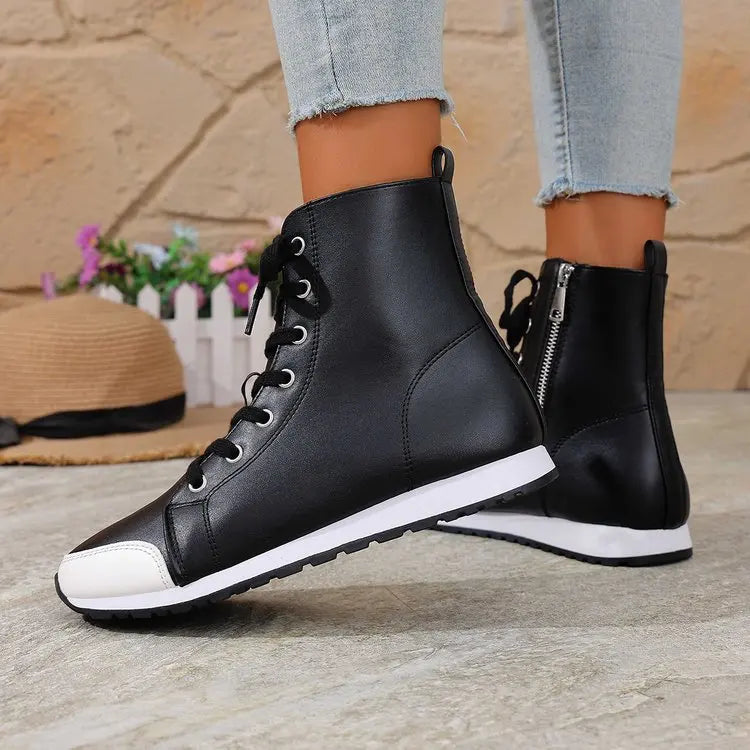 White women's spring and fall ankle boots from Corporación Turística, featuring comfortable slip-on design.