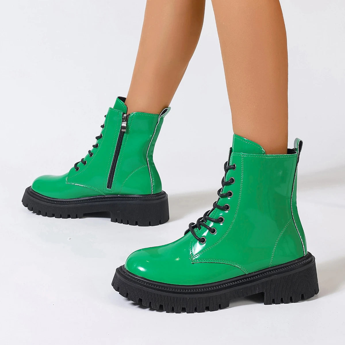 White high-quality women's leather ankle boots with a sleek design, perfect for stylish casual or dressy outfits.