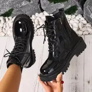 White women's high-quality leather ankle boots with a sleek design, perfect for stylish everyday wear.