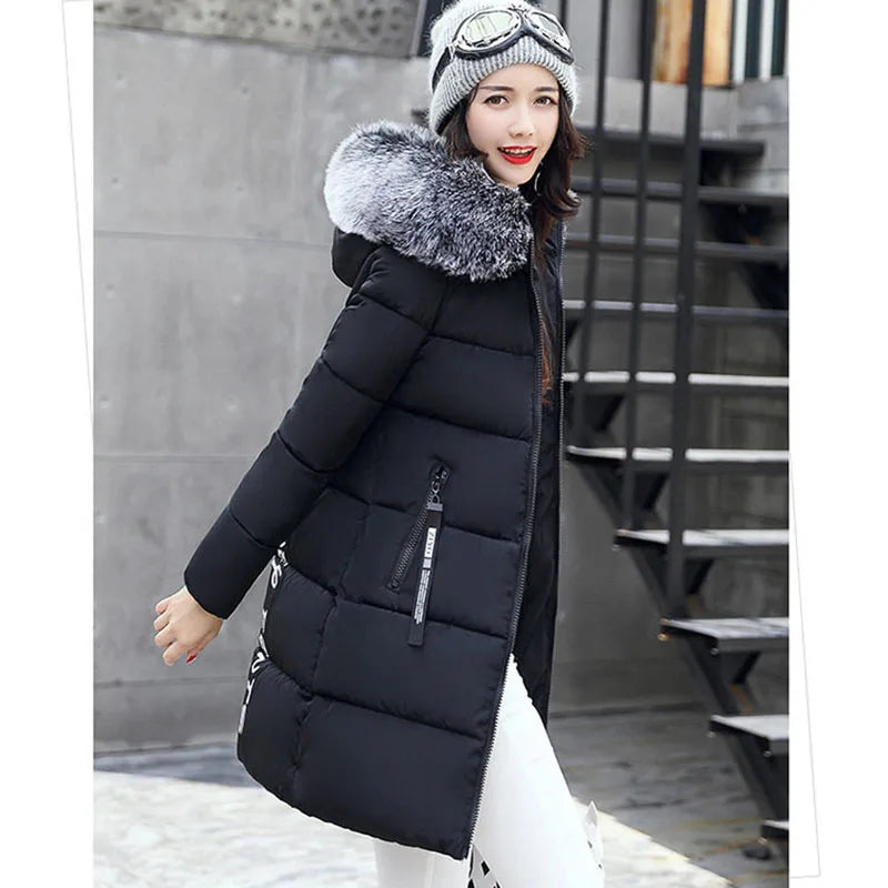 Winter women's parka coat with fur collar from Corporación Turística, featuring a white color and padded design for warmth.