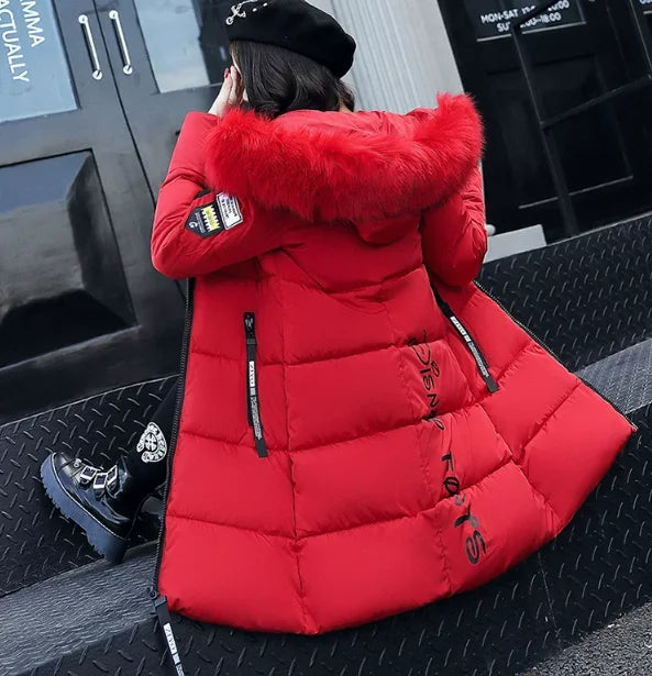 White women's winter parka coat with faux fur collar, by Corporación Turística, designed for warmth and style.