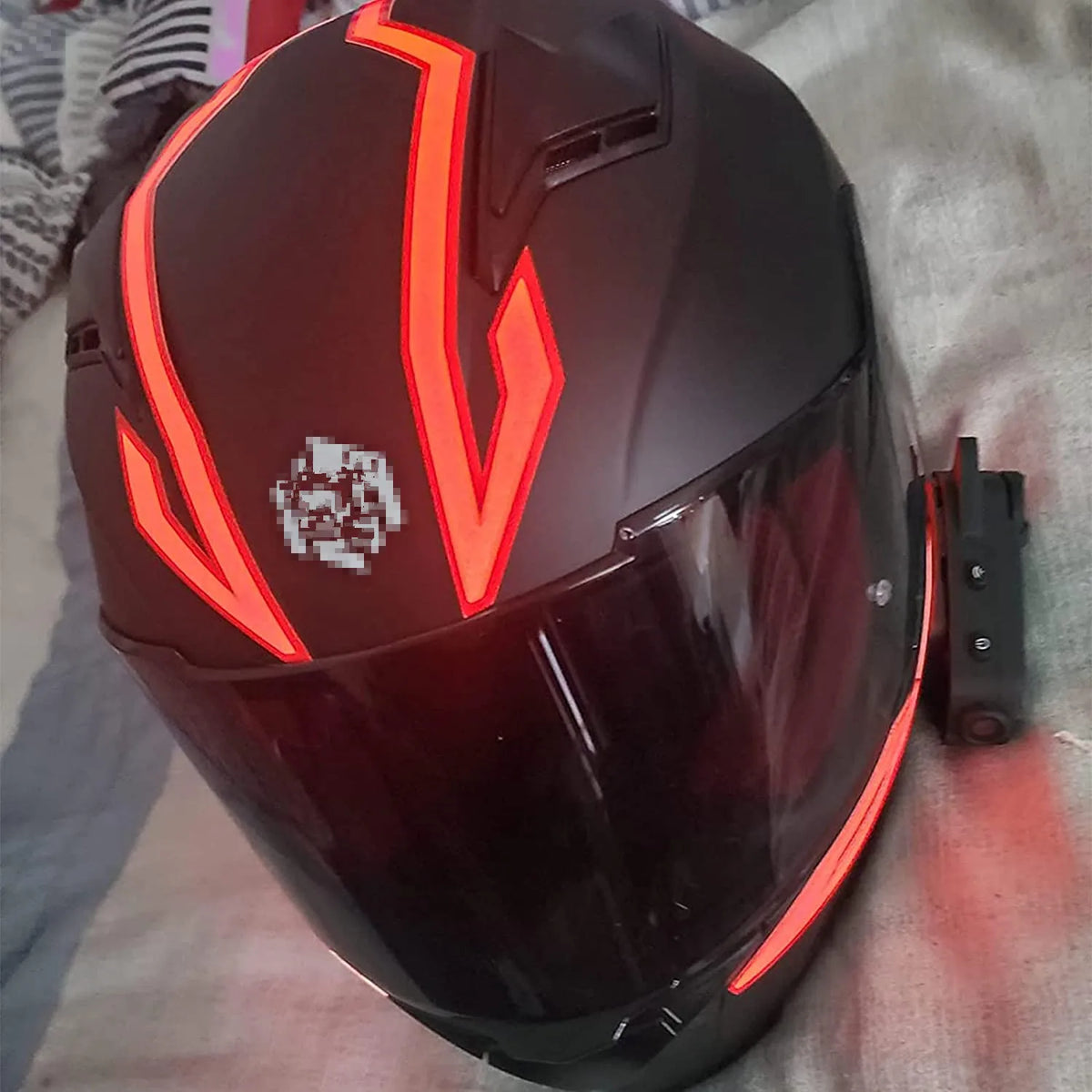 White motorcycle helmet signal light from Corporación Turística, designed for visibility and safety during riding.