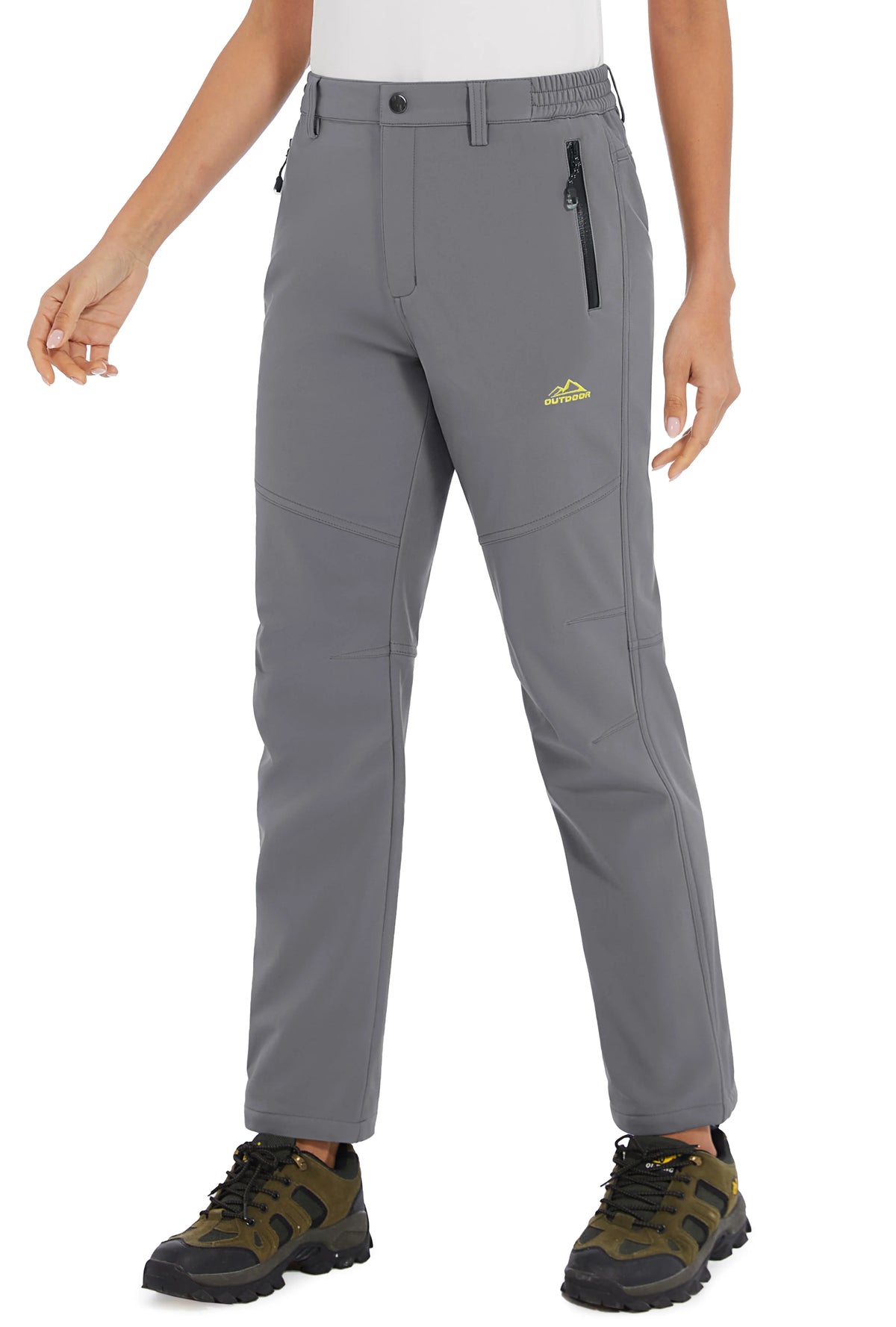 Women’s white waterproof winter pants by Tacvasen, made by Corporación Turística, showing the insulated, weather-resistant fabric.