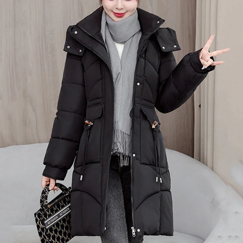 White women's hooded parka coat by Corporación Turística, medium-length winter jacket with a cozy hood and modern style.