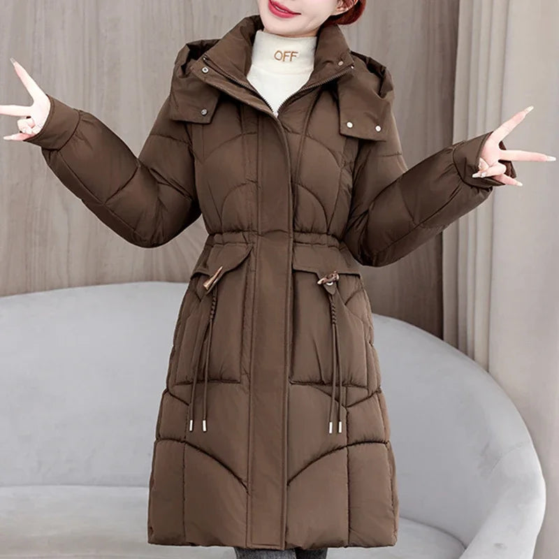 White women's hooded parka coat by Corporación Turística, medium-length winter jacket with a cozy hood.