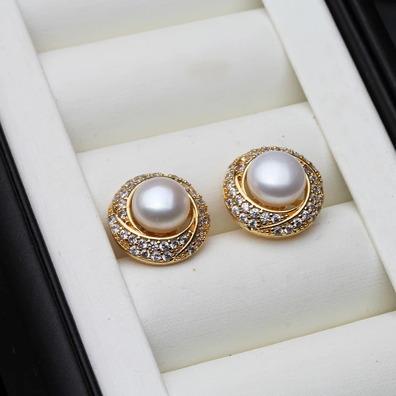 Elegant white freshwater pearl earrings for women by Corporación Turística, showcasing smooth, round pearls on silver hooks.