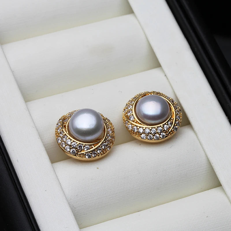 Elegant white freshwater pearl earrings for women, featuring natural water droplets, crafted by Corporación Turística.
