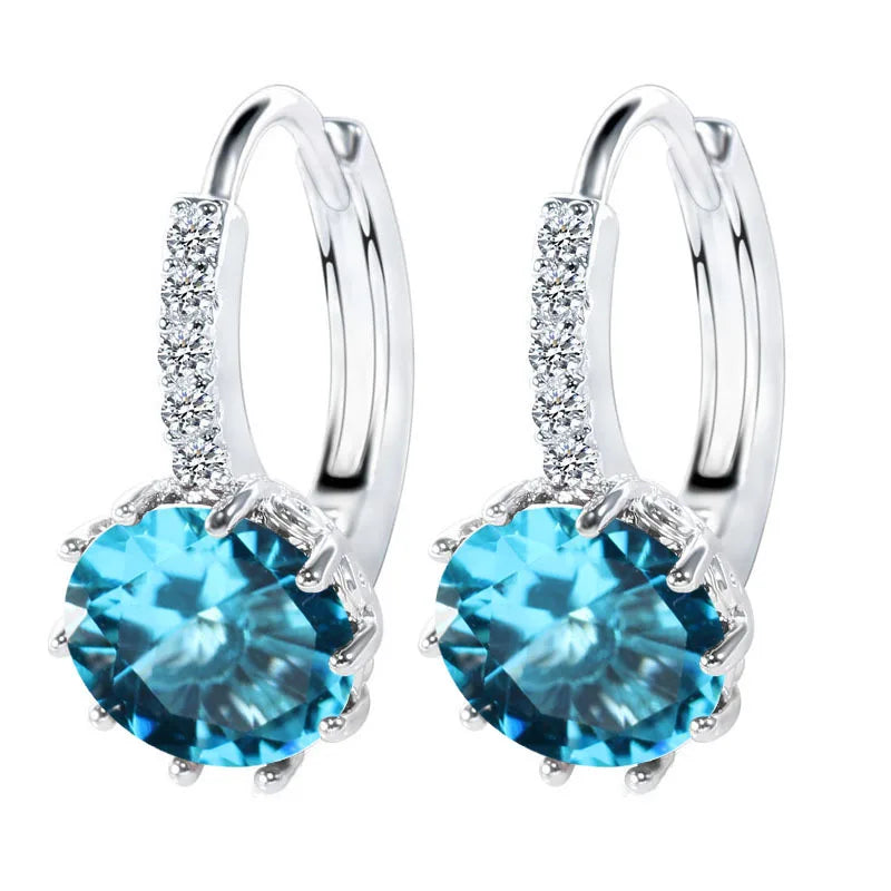 Silver 925 hoop earrings for women by Corporación Turística, showcasing shiny, authentic silver hoops on a white background.