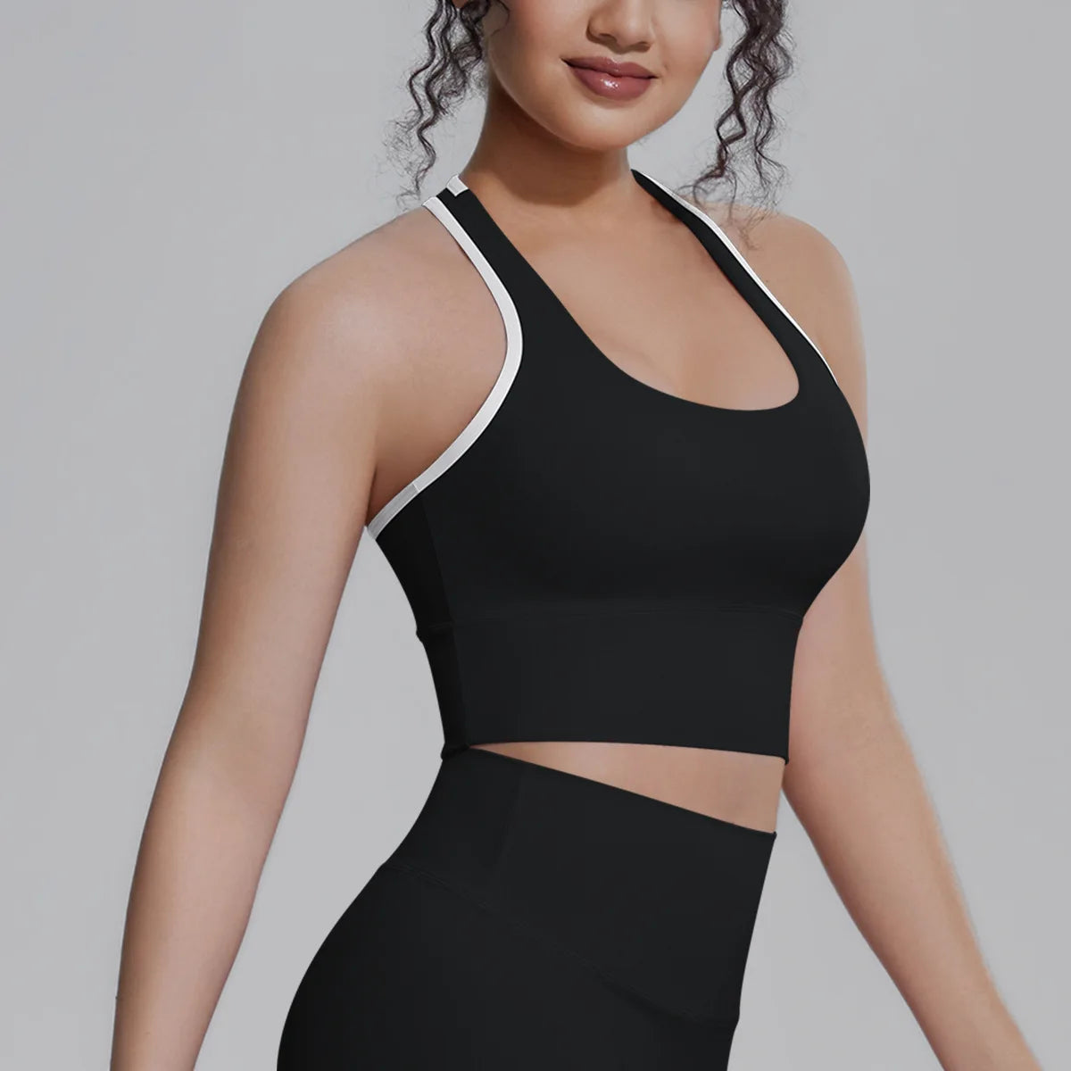 White women's sports top by Corporación Turística, ideal for fitness, running, and training activities.