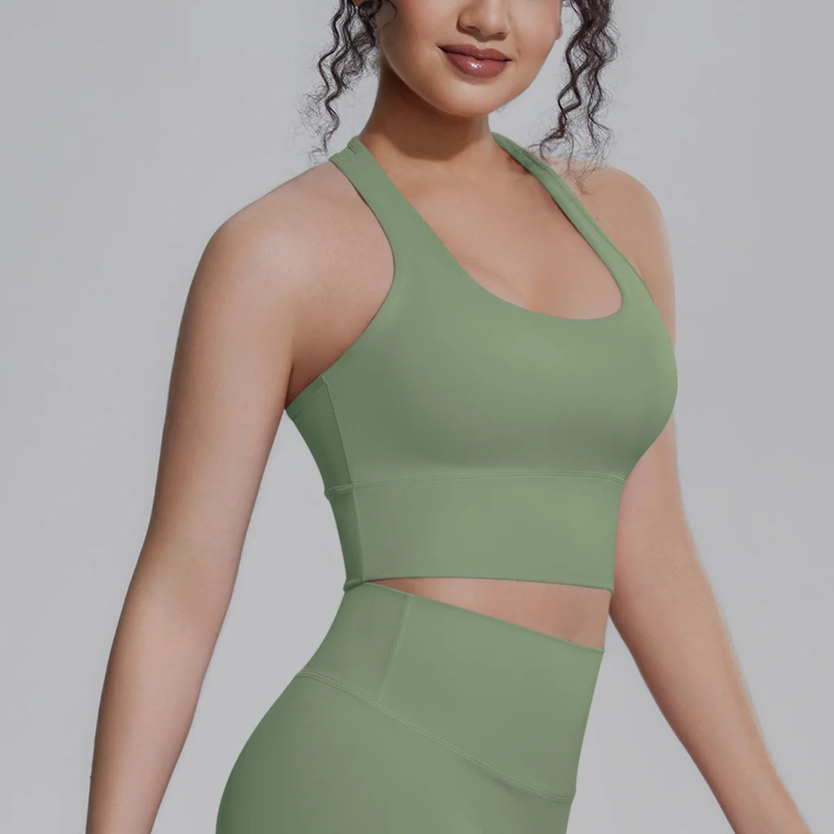 White women's sports top by Corporación Turística, ideal for fitness, running, and training activities.