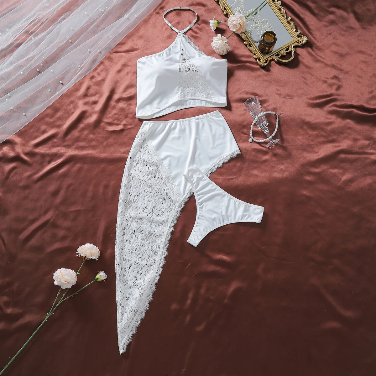 White sexy lingerie three-piece set with a flared skirt, featuring intricate lace details and a revealing design by Corporación Turística.