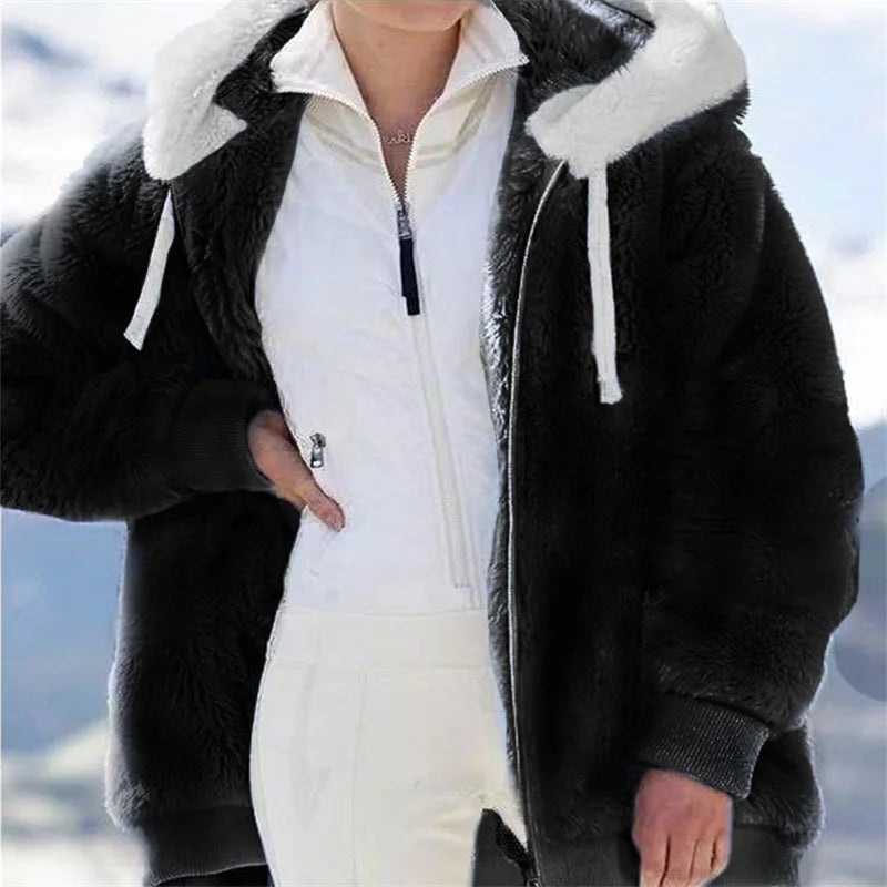 White women's oversized fleece zip-up coat by Corporación Turística, showcasing a cozy, relaxed fit with a front zipper.