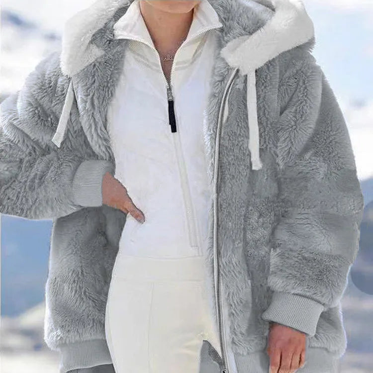 White women's fleece zip-up oversized coat by Corporación Turística, featuring a cozy, relaxed fit and front zipper closure.
