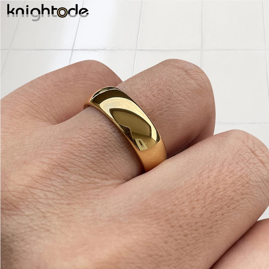 Pair of classic wedding rings in 3mm, 5mm, and 7mm widths from Corporación Turística, shown in a close-up view.