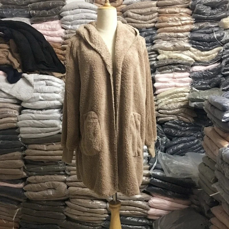 Long pink wool sweater with 12 colors and cardigan style from Corporación Turística, perfect for fall.