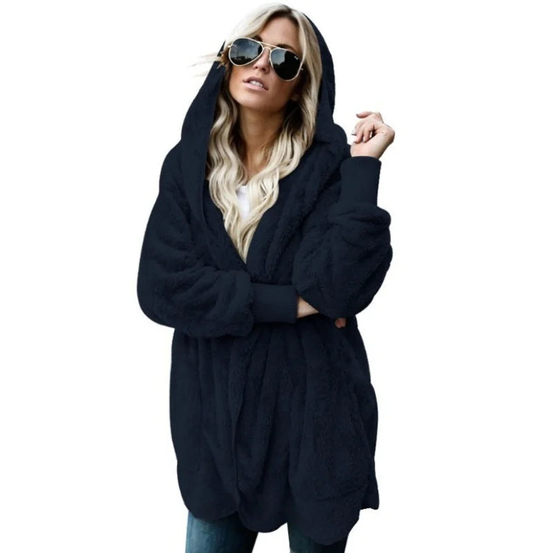 Long pink wool cardigan in 12 colors from Corporación Turística, featuring a cozy, oversized design for autumn wear.