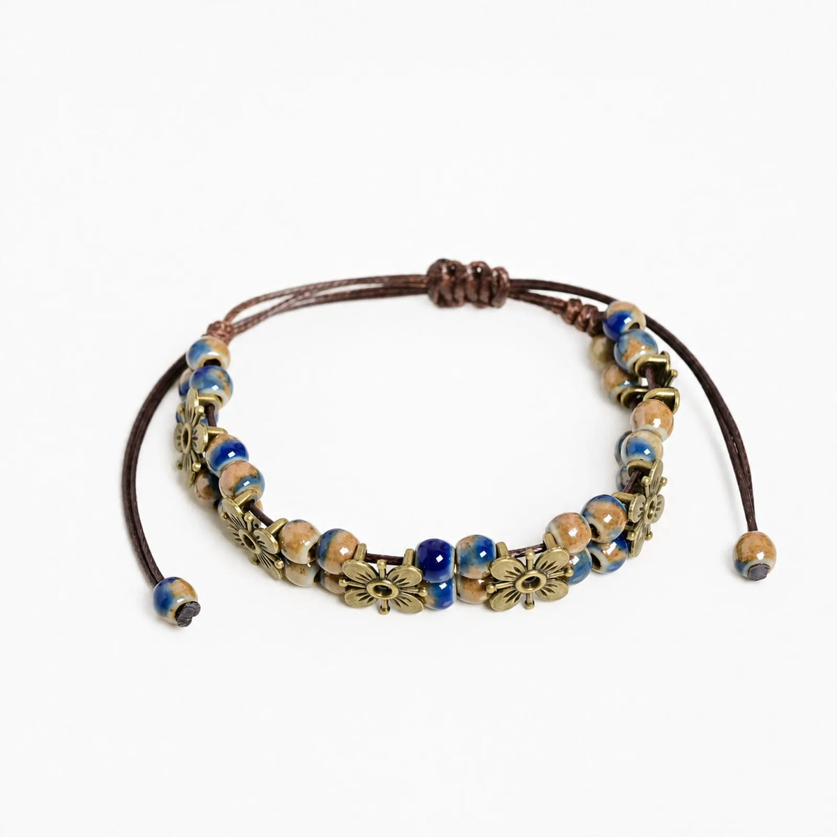 Handmade ceramic bead chain bracelet with crafted links, showcasing intricate design and artisanal detail.