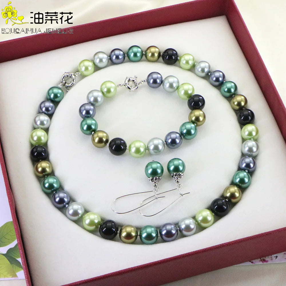 Set of necklace and bracelet with round concave beads from Corporación Turística, featuring a stylish and coordinated jewelry design.