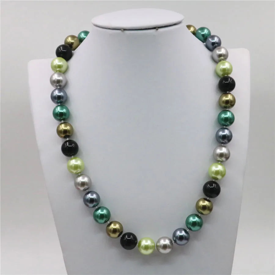 Set of necklace and bracelet with round beads from Corporación Turística, featuring colorful, polished stone accents.