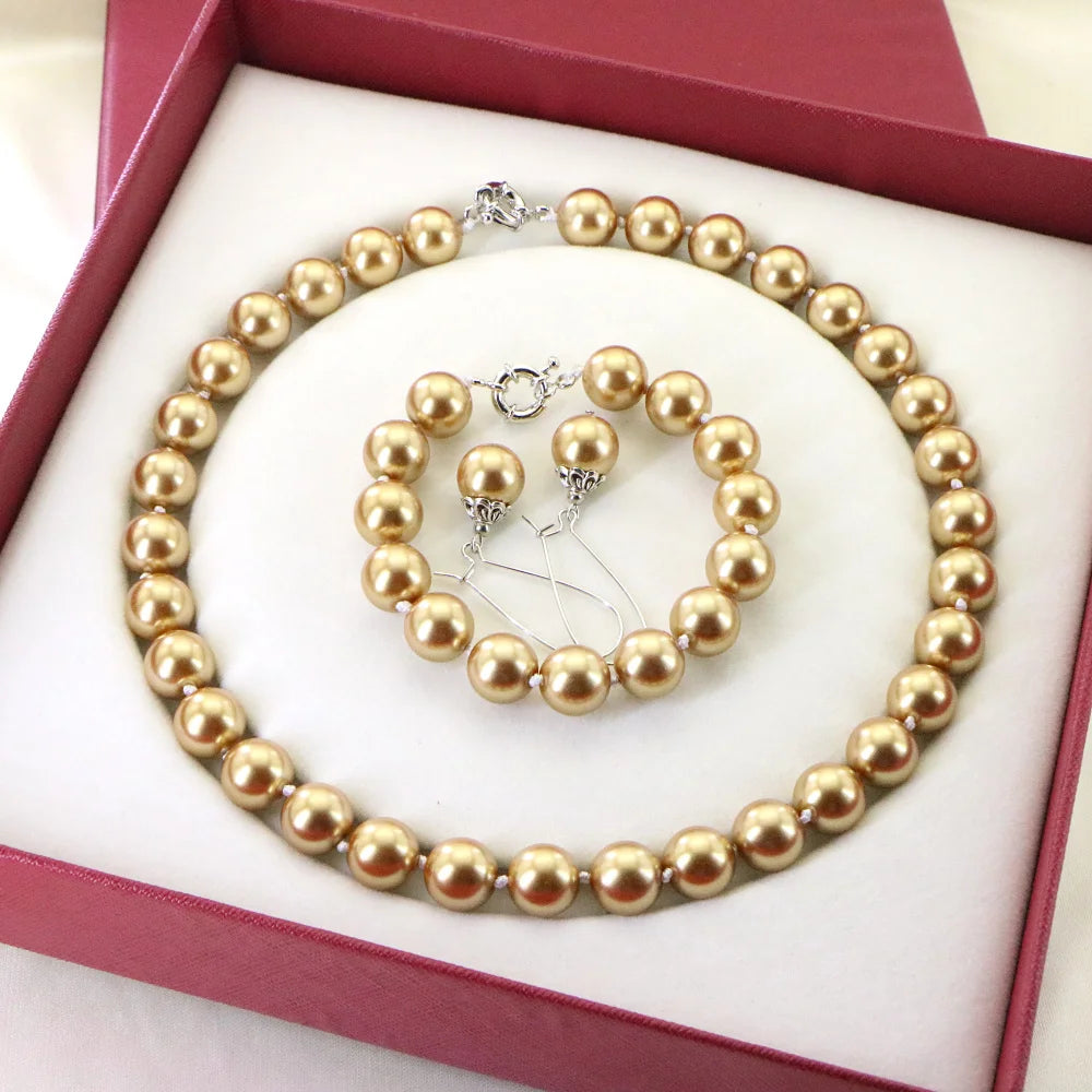 Set of necklace and bracelet with round bead accents by Corporación Turística, featuring colorful, handcrafted jewelry.