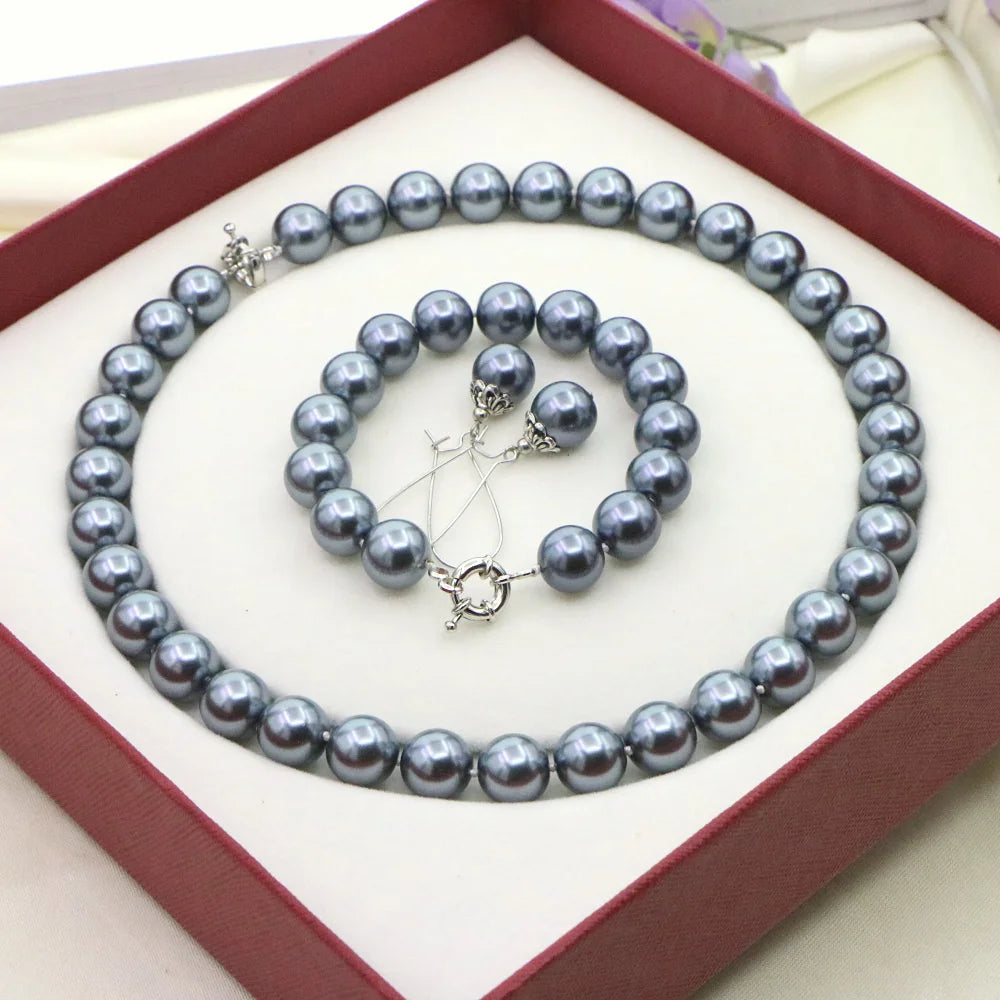 Set of necklace and bracelet with round beads from Corporación Turística, featuring a coordinated jewelry design.
