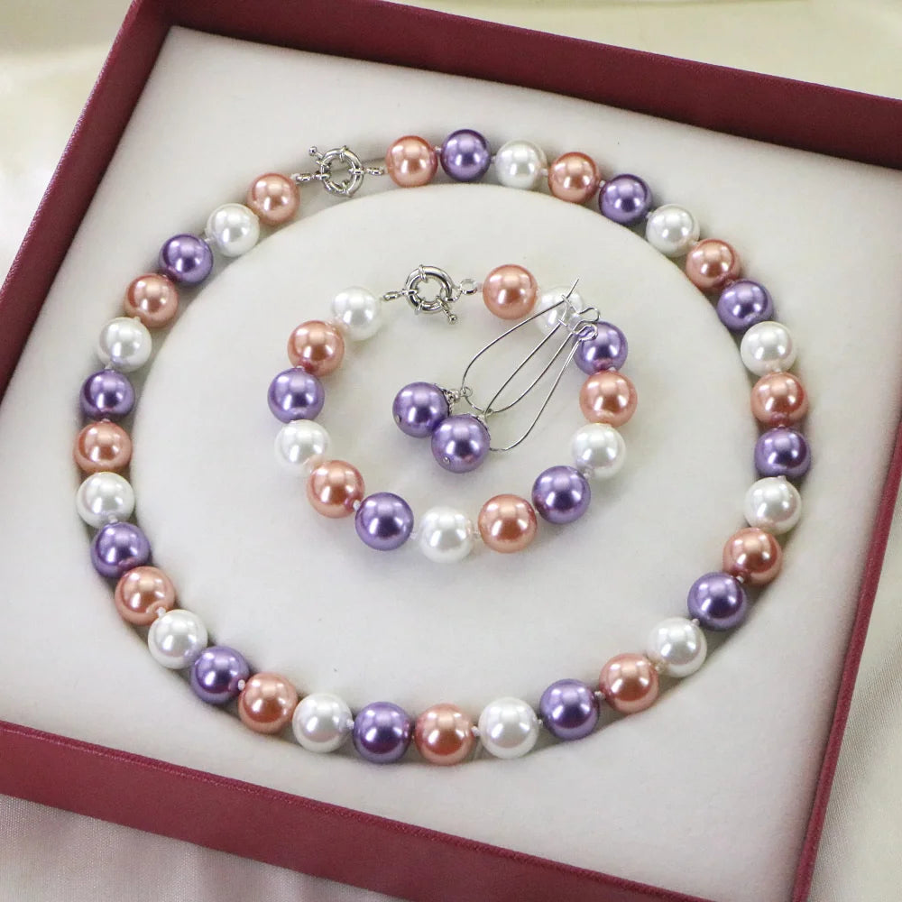 Corpoación Turística set with round beaded necklace and bracelet featuring round beads and natural-colored accents.